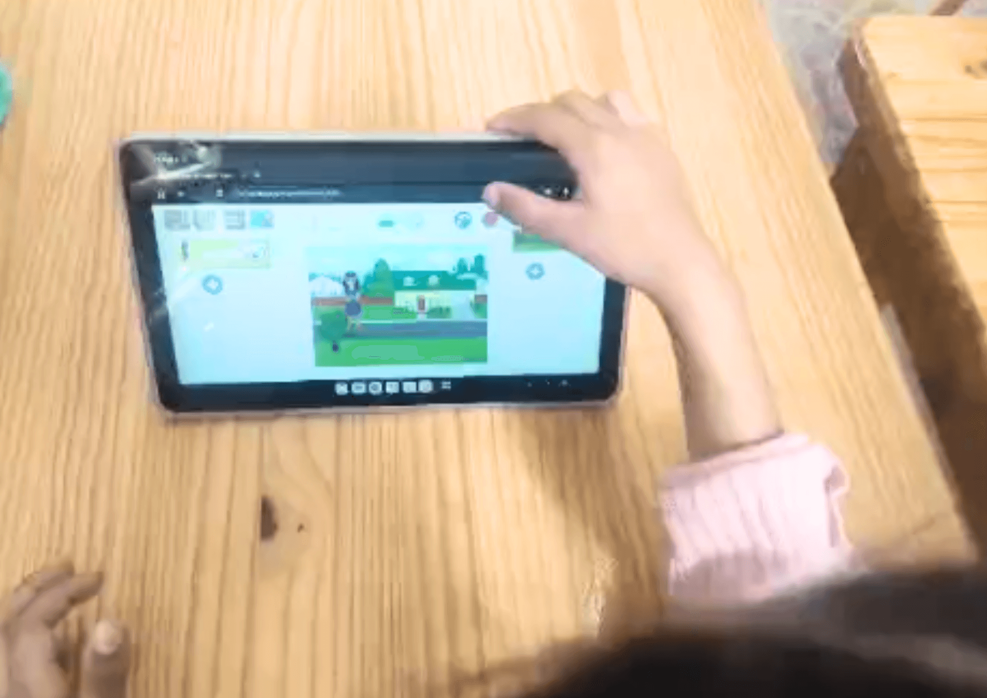 Kid using scratch jr ot build project